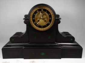 A late 19th/early 20th century black slate mantel clock - the gilt metal dial with a chapter ring