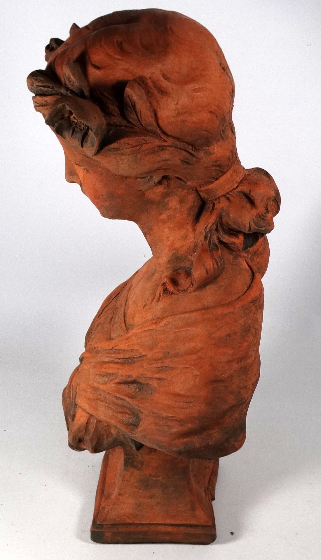 A Neoclassical terracotta female bust - flowers in her hair and raised on a square base, height - Image 2 of 2