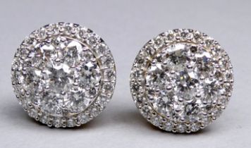 A pair of 14ct yellow gold diamond set cluster stud earrings - the brilliant cut diamonds weighing