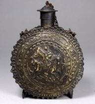 A late 19th/early 20th century Persian tinned brass powder flask - circular showing an image of St