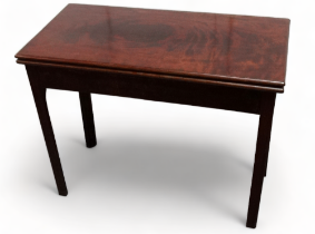 A late George III mahogany tea table - the rectangular top above a concertina action, on caddy