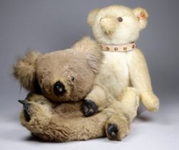 An early 21st century Steiff bear - white plush with pink studded collar, dated 2008, height 27cm,