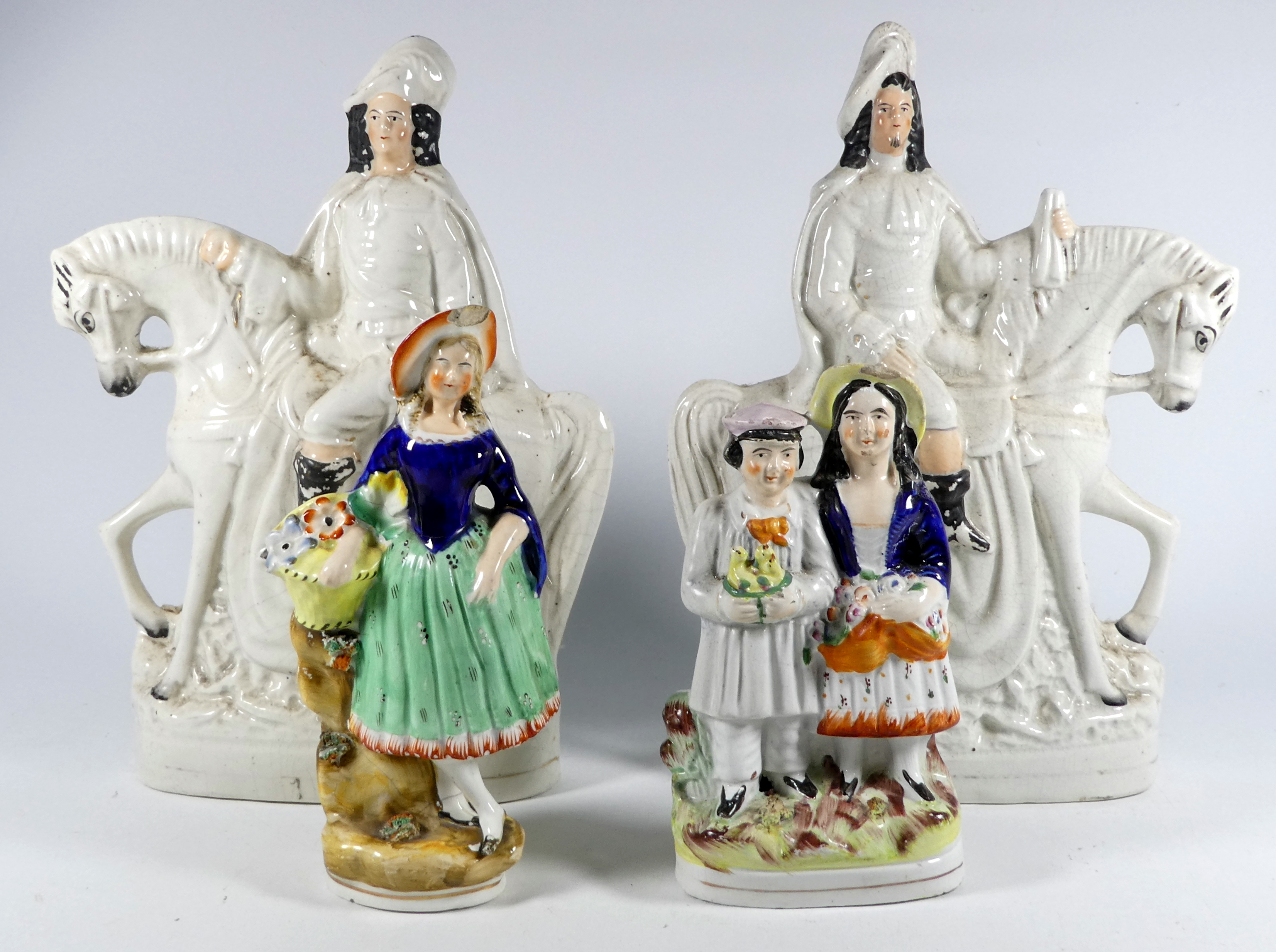 A 19th century flatback figural group - one figure holding a birds nest, height 20cm, together