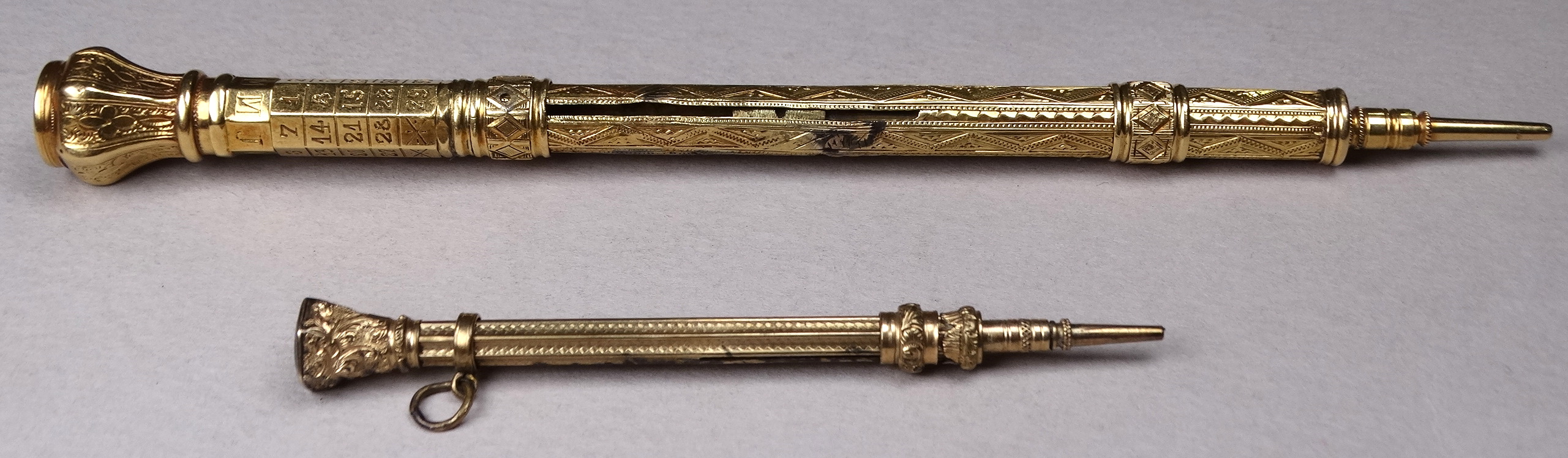 A 19th century gilt pen pencil - incorporating a French perpetual calendar to the top, with a - Image 2 of 4