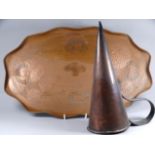 An early 20th century copper tray - in the Art Noveau style, oval with a shaped edge, together