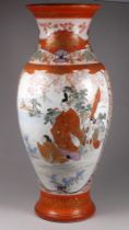 A Japanese Meiji period Kutani vase - baluster shaped and decorated with vignettes of flowers and