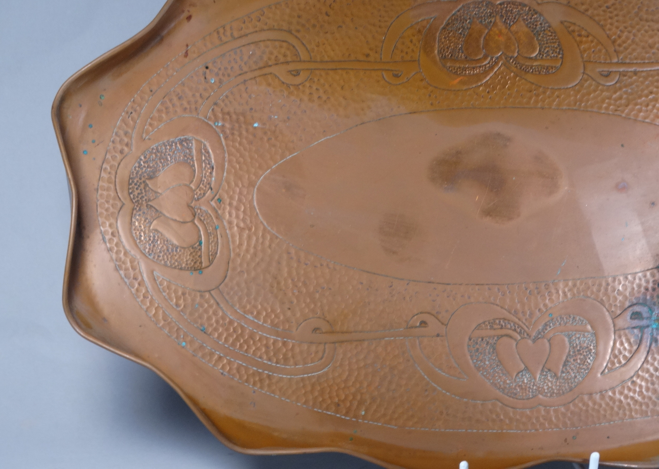 An early 20th century copper tray - in the Art Noveau style, oval with a shaped edge, together - Image 2 of 6