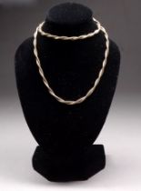 A 9ct gold necklace - of twisted fine link form, weight 6.4g.