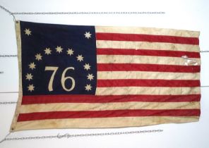 A Bennington flag - stitched cotton with printed quadrant, 82 x 123cm, together with a copper and