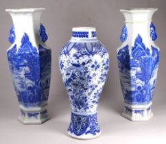 A pair of Chinese blue and white vases - of hexagonal form and decorated with a landscape scene,