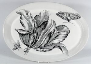 An oval platter designed by Louis Jansen van Vuuren for Mervyn Gers - decorated with a black tulip