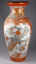 A Japanese Meiji period Kutani vase - baluster shaped and decorated with vignettes of flowers and