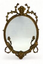 A Victorian gilt gesso girandole mirror - with an oval plate and pair of foliate candle branches, 75