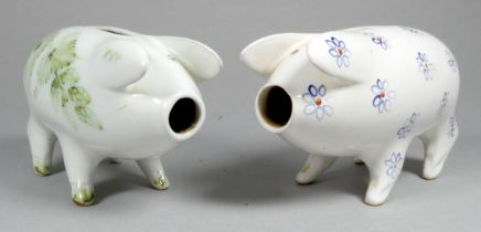 A Rye Pottery piggy bank - decorated with blue flowers, width 14cm, together with another