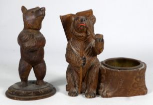 An early 20th century Black Forest bear - seated with a pipe beside a pin dish, stamped 'Aeschi',