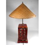 A 20th century oriental table lamp - of square form with abacus panels and a conical rafia shade,