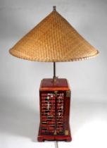 A 20th century oriental table lamp - of square form with abacus panels and a conical rafia shade,