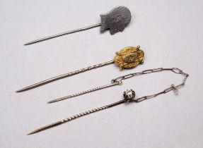 A gilt and diamond set stock pin - together with two further stock pins, one silver example in the