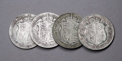 An Edward VII half crown - dated 1906 and another 1910, together with two George V half crowns, 1916