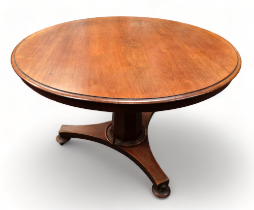 A Victorian mahogany tilt top table - on an octagonal baluster support and tripod base, diameter