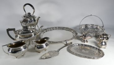 An early 20th century four piece silver plated tea service - part gadrooned with ebonised