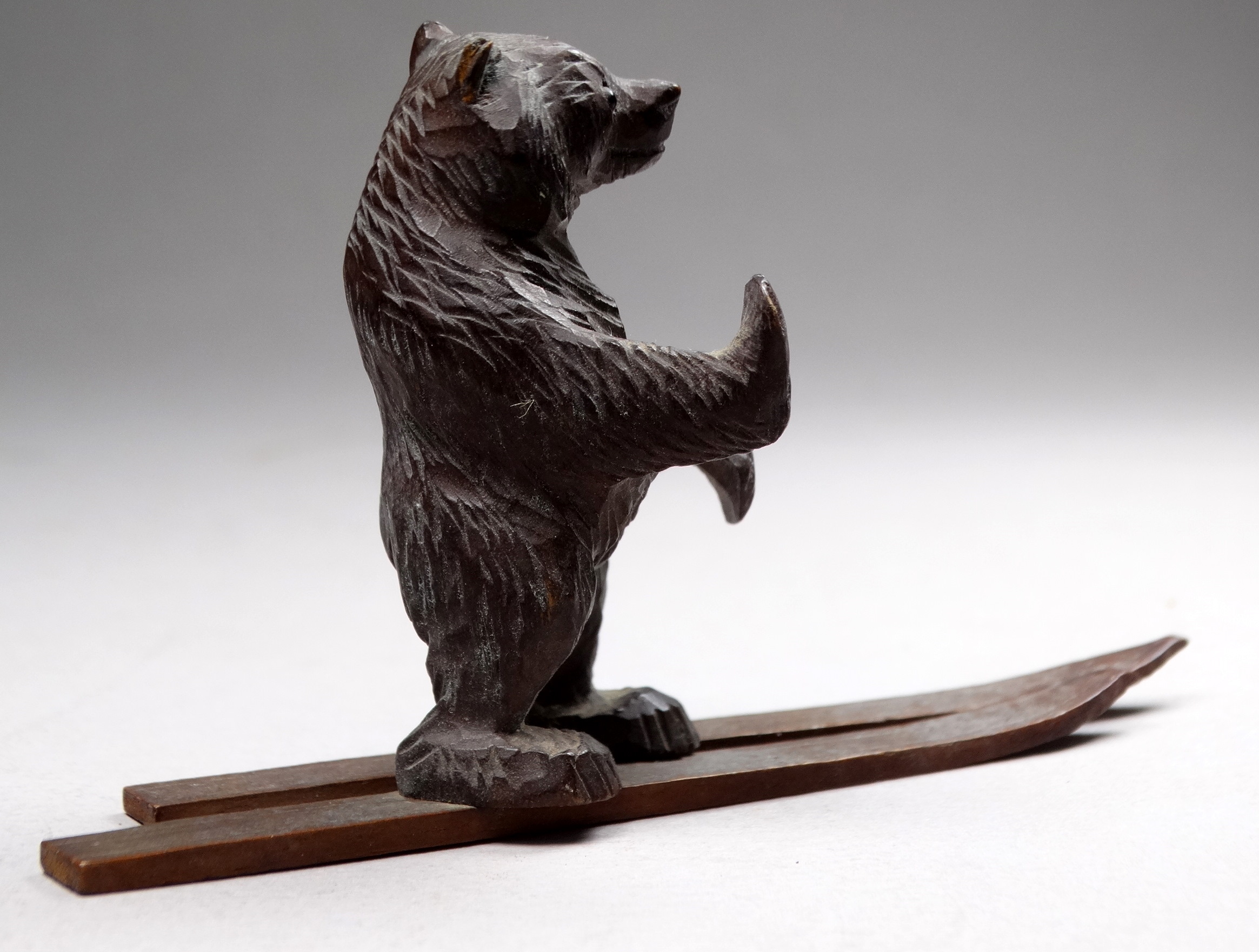 An early 20th century Black Forest bear - standing on skis, height 6cm, together with another, two - Image 6 of 6