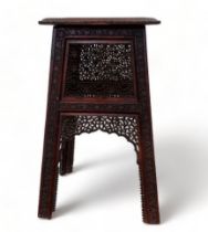 An Indian late 19th century carved occasional table - the square top on a tapering square support