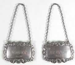 A pair of silver decanter labels - Sheffield 1980, Francis Howard Ltd, rectangular with a foliate