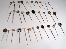 A quantity of 19th century and later gilt metal and enamel stock pins - some fitted with gemstones