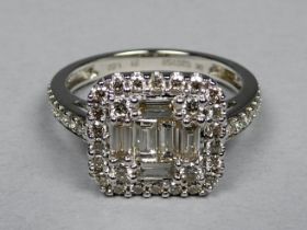 A 9ct white gold square panel diamond set dress ring - the baguette cut and circular brilliant cut