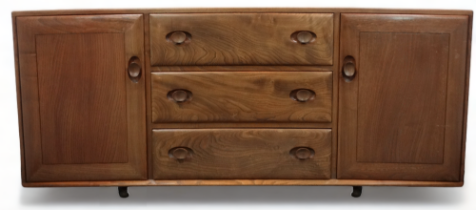 An Ercol elm sideboard - of dovetail construction, the rectangular top above three central drawers