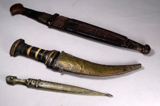 An early 20th century Indonesian dagger - with textured leather scabbard, length 36cm, together with