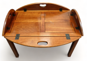 A 19th century style butlers tray top occasional table - the panelled top with folding sides on a