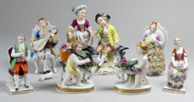 A pair of late 19th century Chelsea style figures - modelled as cherubs with goats, raised on oval