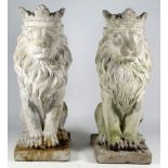 A pair of reconstituted stone lions - seated with coronets, height 35cm.