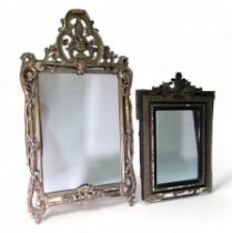 A gilt cast metal framed wall mirror - the rectangular plate within a pierced foliate frame with