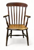 A 19th century ash and elm armchair - with stick back, open arms, and shaped seat, on turned legs,