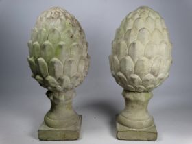 A pair of contemporary cast concrete pineapple finials - raised on a square base, height 30cm.