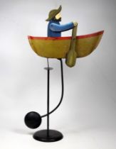 A 20th/21st century weighted automaton oarsman - polychrome painted in the form of a fisherman,
