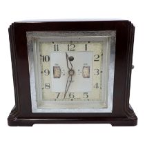 A vintage Smiths mains power clock radio alarm clock - with an Art Deco brown Bakelite case, the