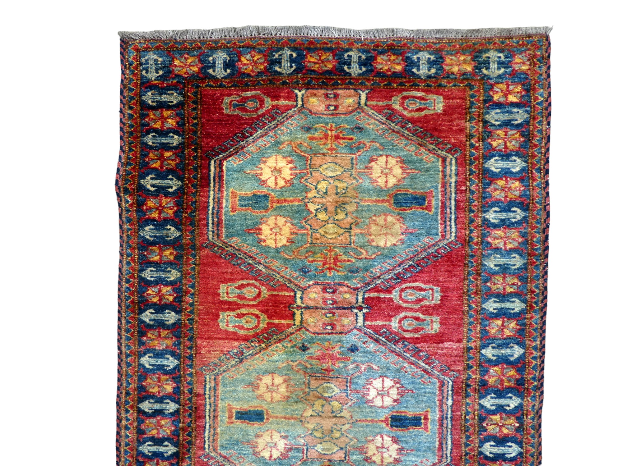 A Bokhara runner - with six light blue medallions on a red ground within a blue border, 286cm x - Image 2 of 3