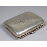 A silver cigarette case - Birmingham 1928, of rectangular form and engraved with a monogram,