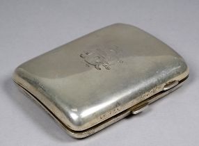 A silver cigarette case - Birmingham 1928, of rectangular form and engraved with a monogram,