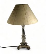 A silver plated neo classical table light - of reeded columnar form and raised on three paw feet,