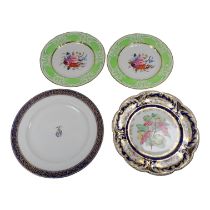 A pair of early 19th century Coalport cabinet plates - decorated with flowers to the centre within