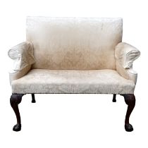 A George III mahogany two seat sofa - upholstered in cream damask and raised on ball and claw