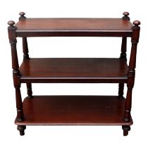 An early Victorian mahogany three tier buffet - the rectangular shelves with turned supports and