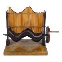 A vintage educational sine wave demonstrator - in hardwood, height 26cm.