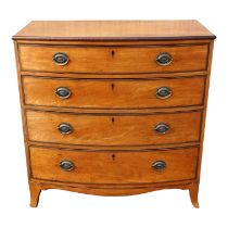 A George III satinwood bowfront chest of drawers - with an arrangement of four long graduated