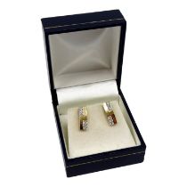 A pair of gilt and cubic zirconia ear studs - boxed